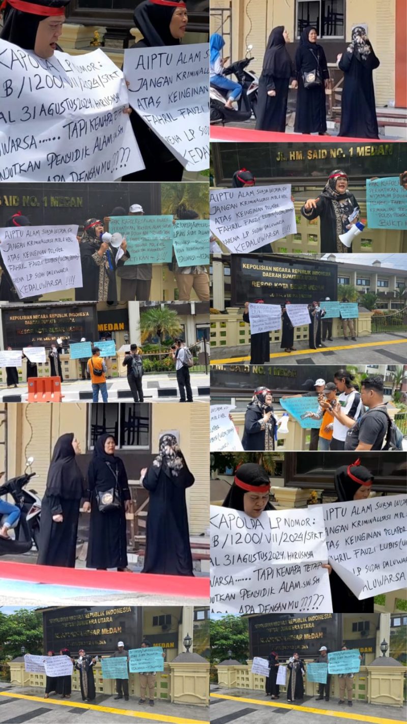 Emak-emak yang mengaku jadi korban kriminalisasi membawa sejumlah poster di depan Mapolrestabes Medan, Rabu (3/9)